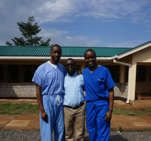 Lwala_Fred-Ochieng-Wycliffe-Omwanda-our-Head-Clinician-and-Milton-Ochieng-stand-in-front-of-the-new-maternal-and-child-health-wing-of-the-Lwala-Hospital-300x279